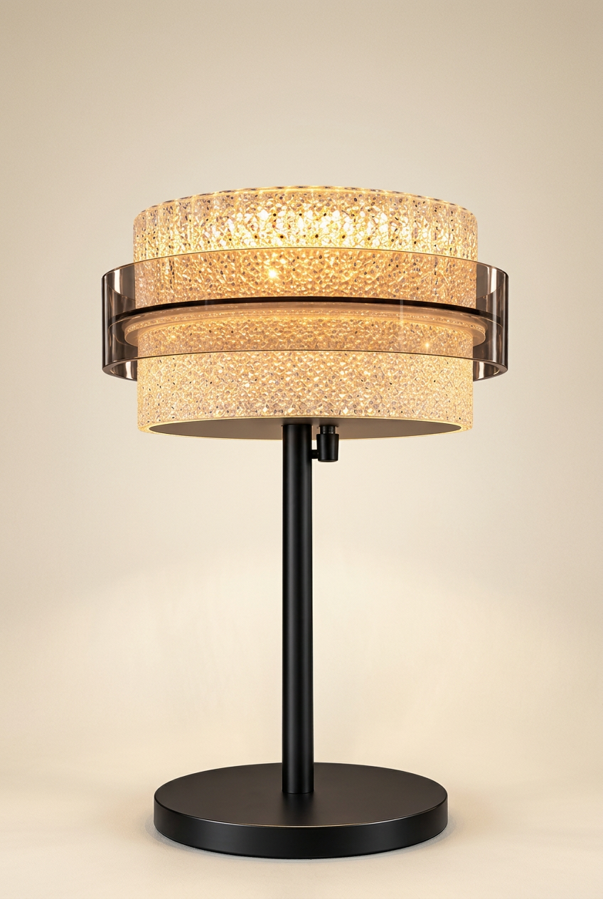 Black and gold acrylic table lamp on an ivory studio background
