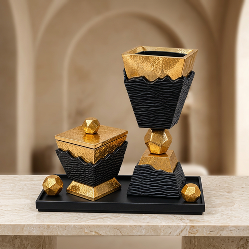 Black and gold Bakhoor Burner Set on a marble console