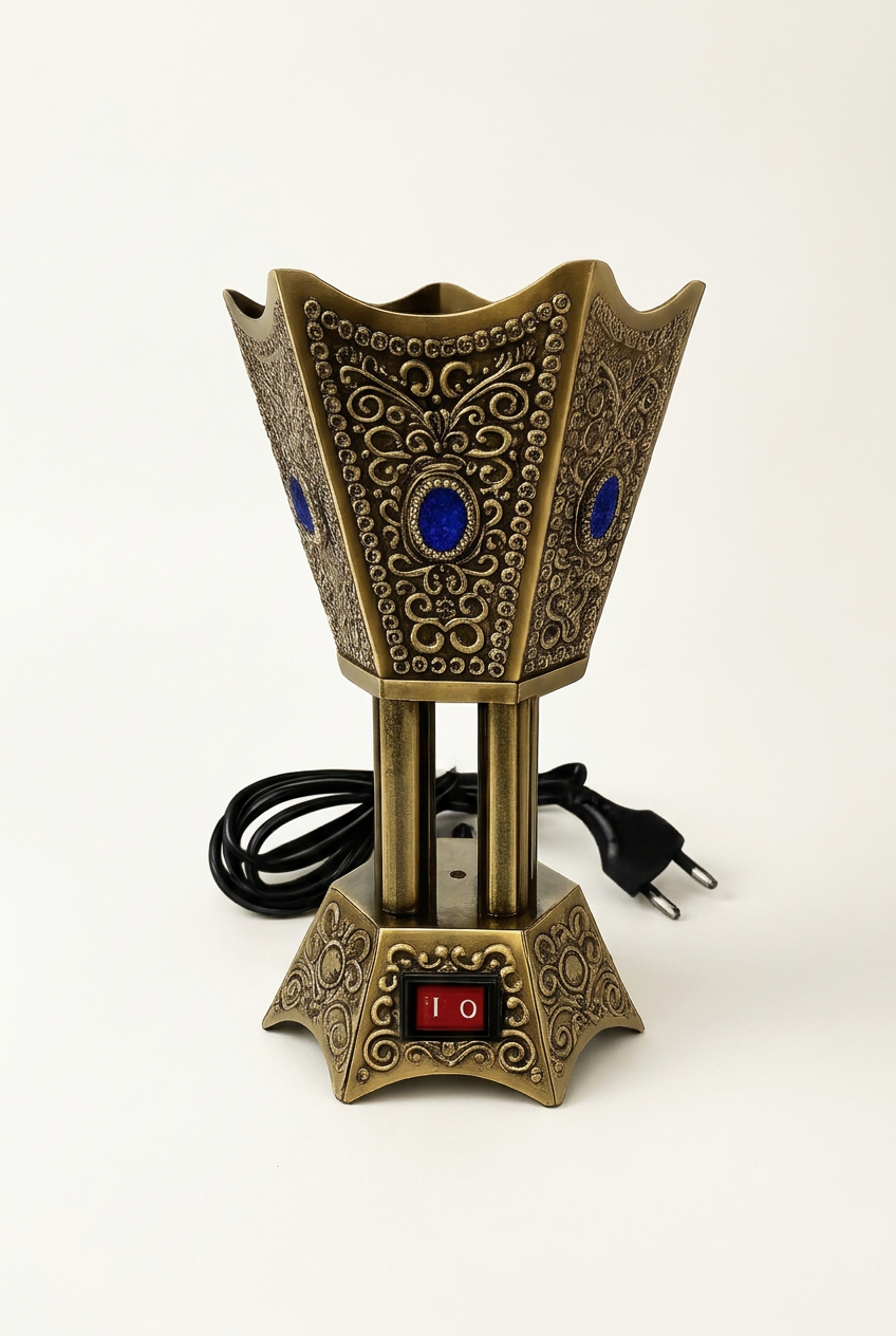 Antique-gold and blue electric bakhoor burner on a studio background